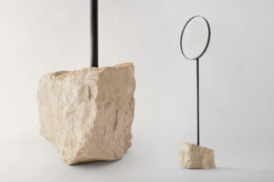 mirror with cream marble base shown in studio view