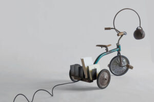 View of Costante, authentic 1960s Italian tricycle transformed into a traveling reading lamp and bookshelf