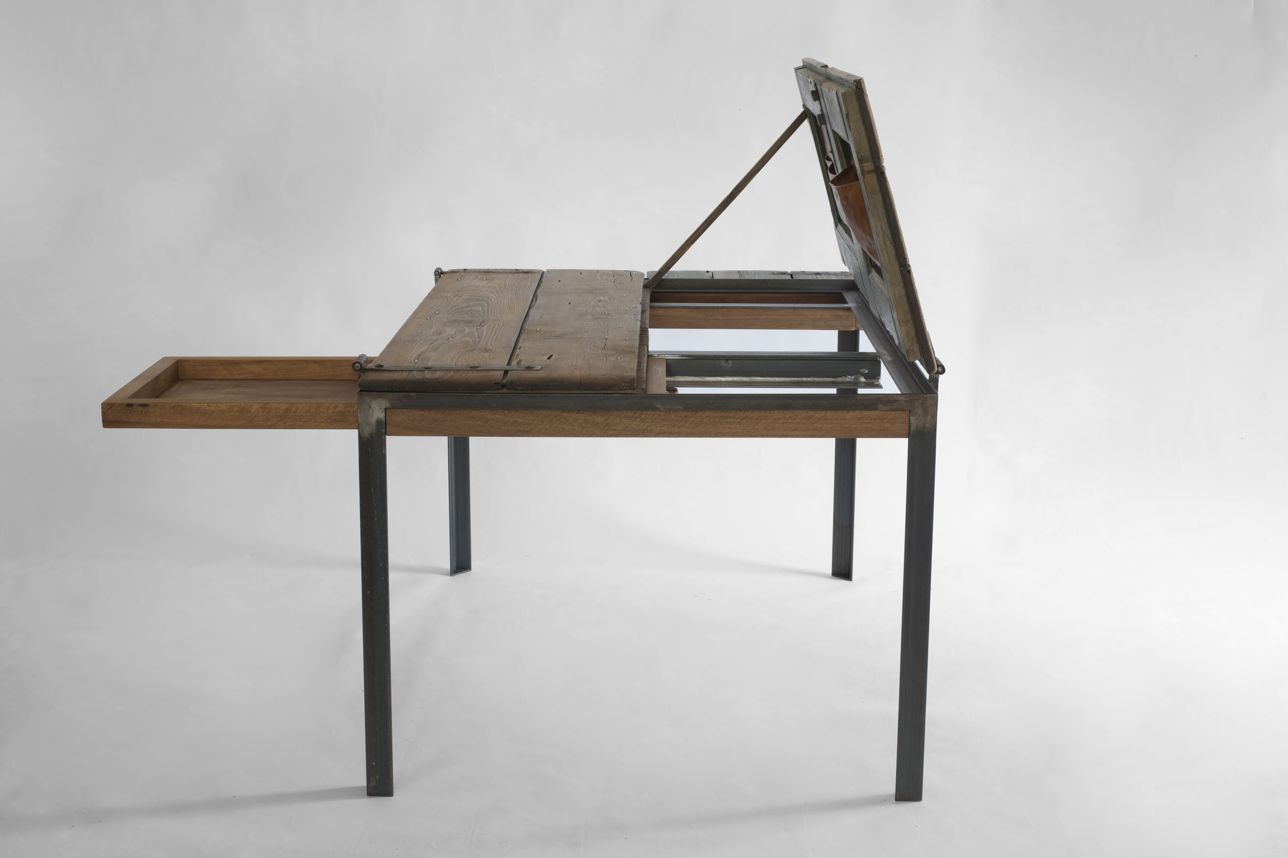 Indoor K table with left side drawer extended, showing the first functional opening