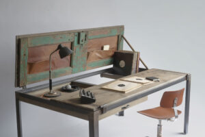 Open view of the Indoor X table used as a desk with vinyl records and accessories displayed