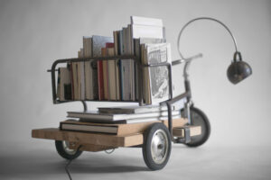 Rear view of See-Clo loaded with books, showing its function as a traveling library