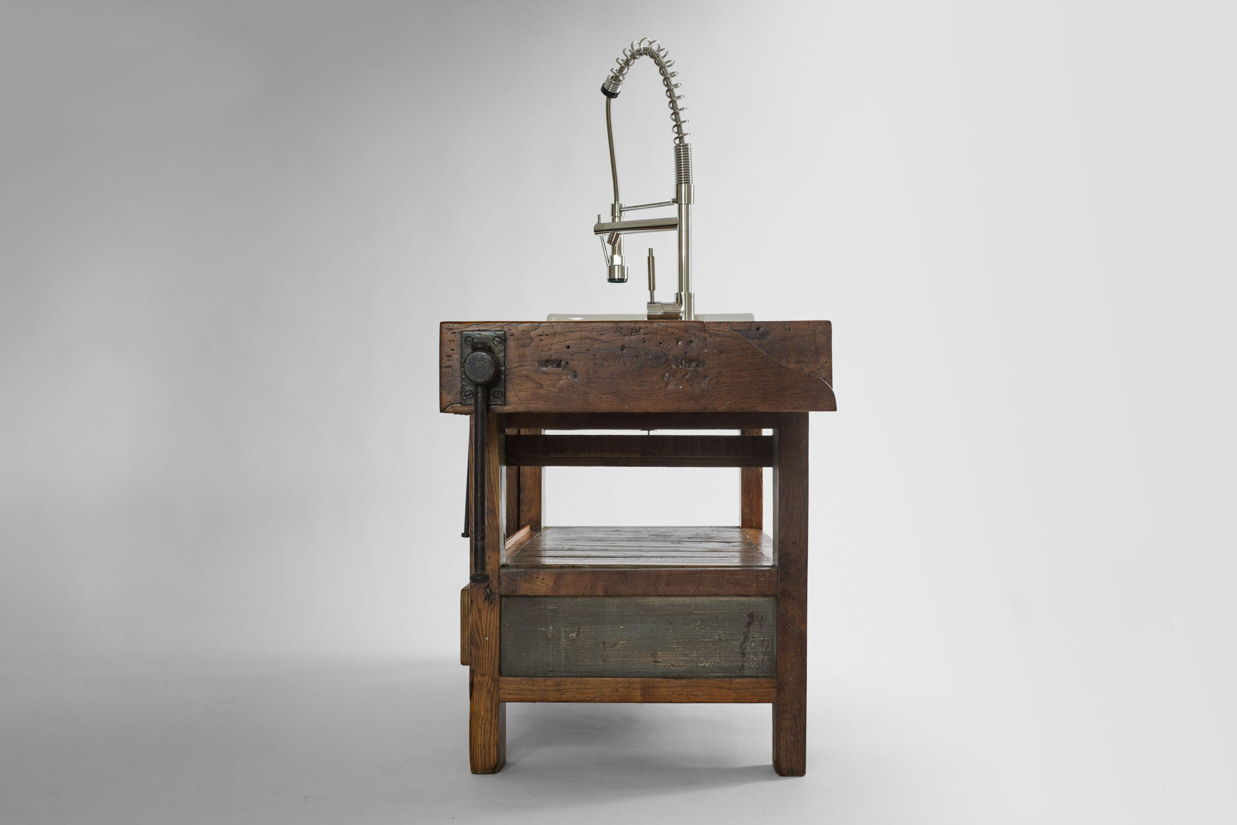 side view of elm table with ceramic sink and steel mixer