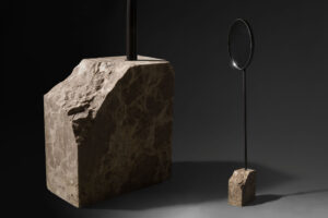 floor standing mirror with emperador base in dark studio view