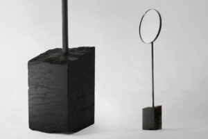 floor standing mirror with black marble base shown in studio view