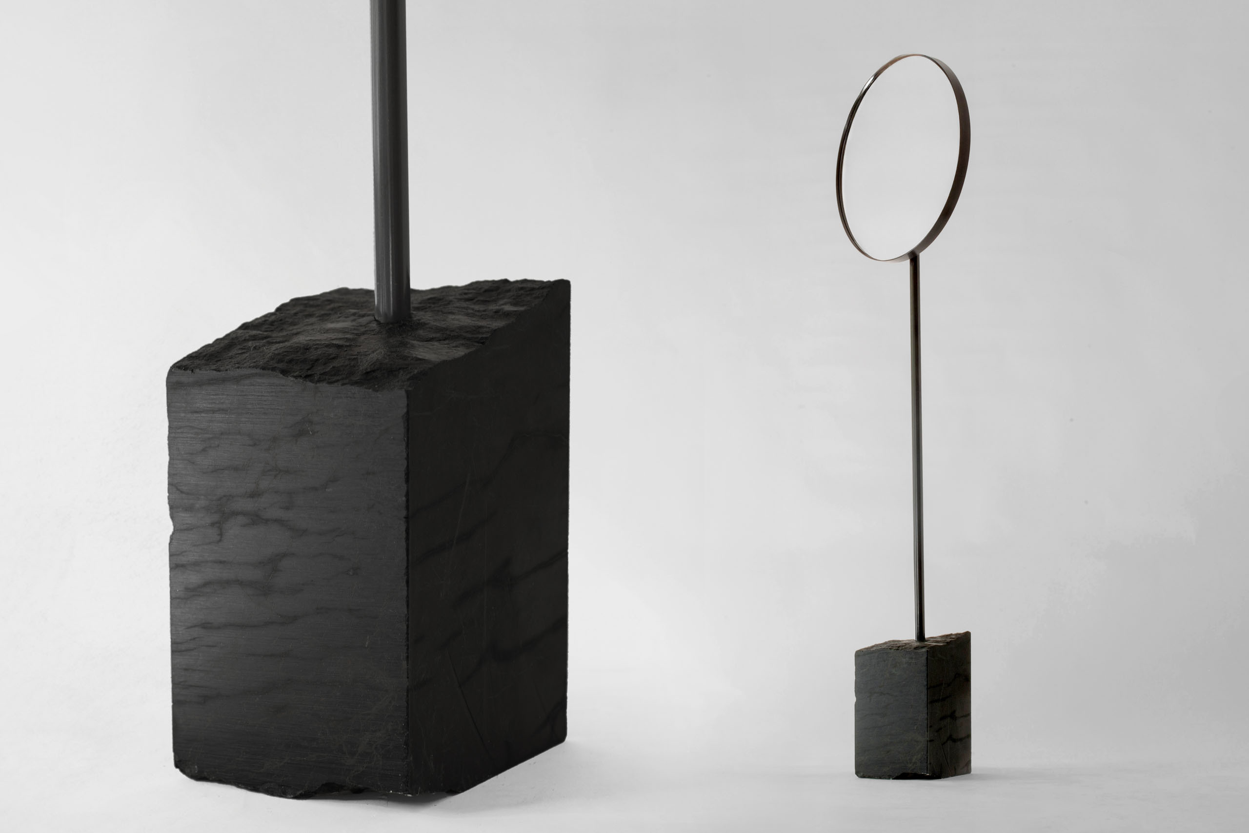 floor standing mirror with black marble base shown in studio view