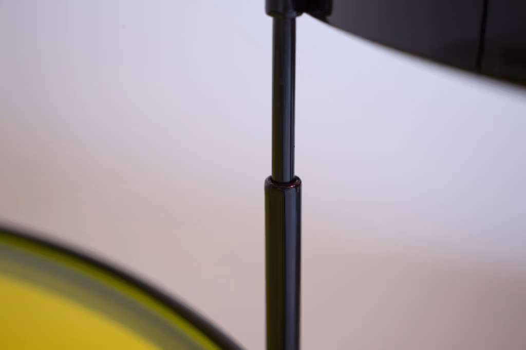 CMYK coffee table by Manoteca, assembly sequence 03: black metal male leg fully inserted into female socket, rotating pin joint complete, structural hinge detail.