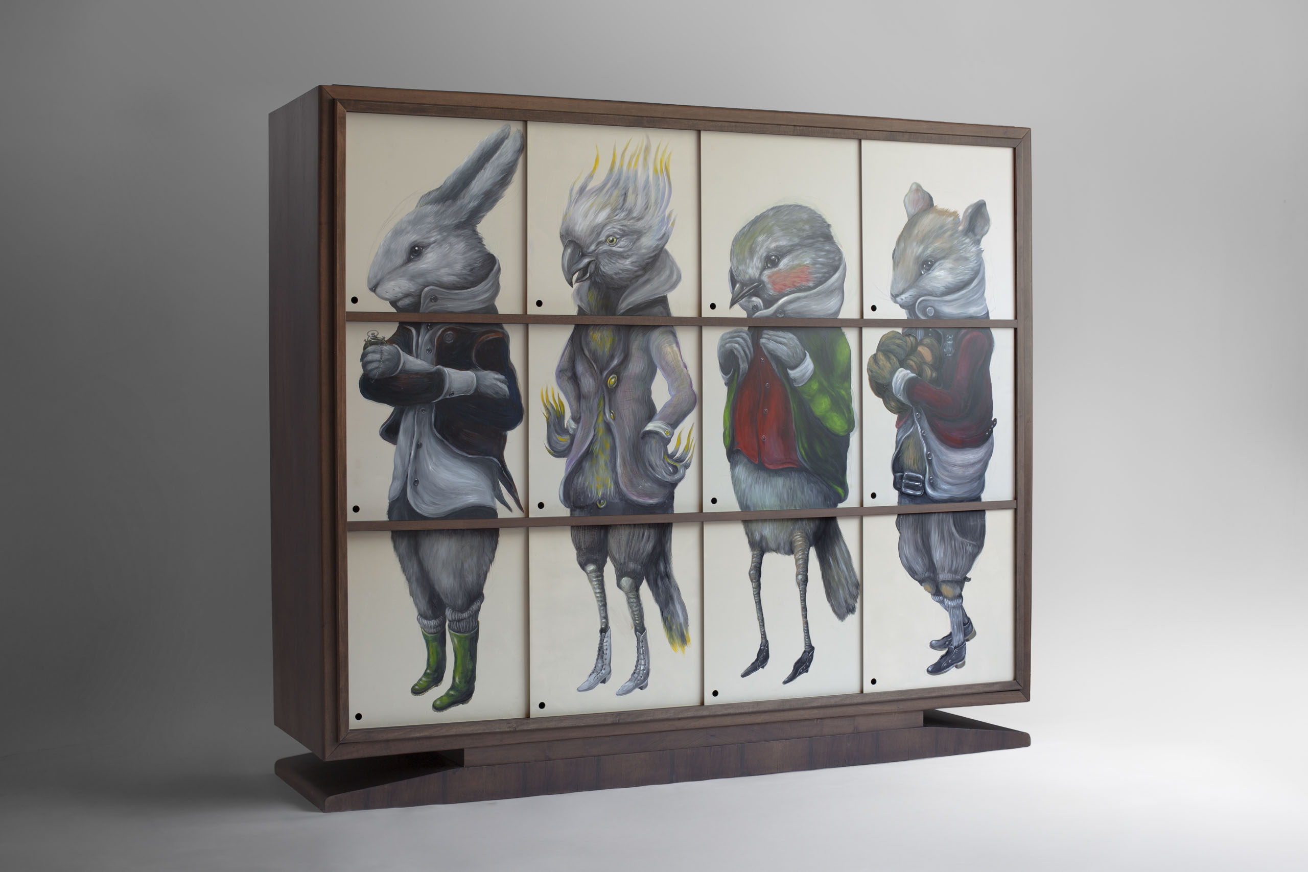 Perspective view of Vestiario Bestiario with closed sliding panels forming anthropomorphic animal figures hand-painted by Ericailcane on walnut veneer cabinet
