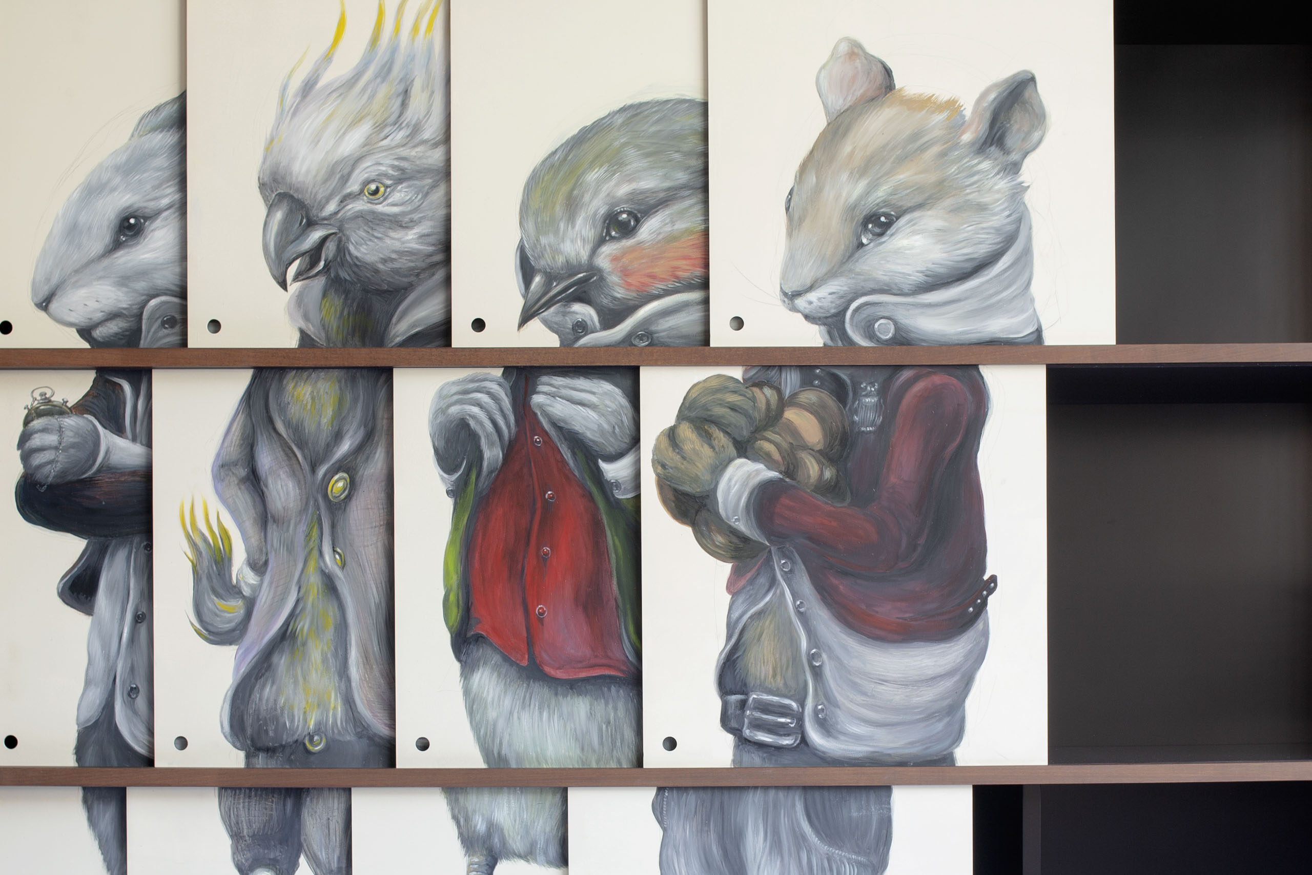 Close-up of overlapping sliding Dibond panels hand-painted by Ericailcane with anthropomorphic animal figures inside Vestiario Bestiario cabinet